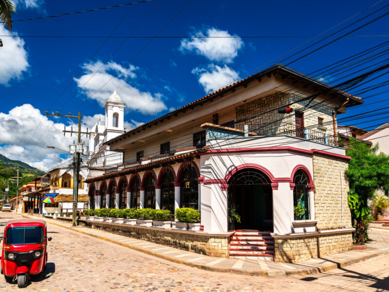 Traditional red tuk-tuk mototaxi in Copan Ruinas town near the Mayan archaeological site of Copan in Honduras